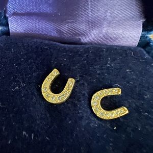 Montana Silversmiths gold horseshoe earrings.